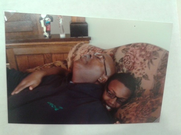 Gerald and Dontae cuddled on the couch
