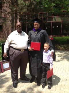 Gerald with his son at graduation