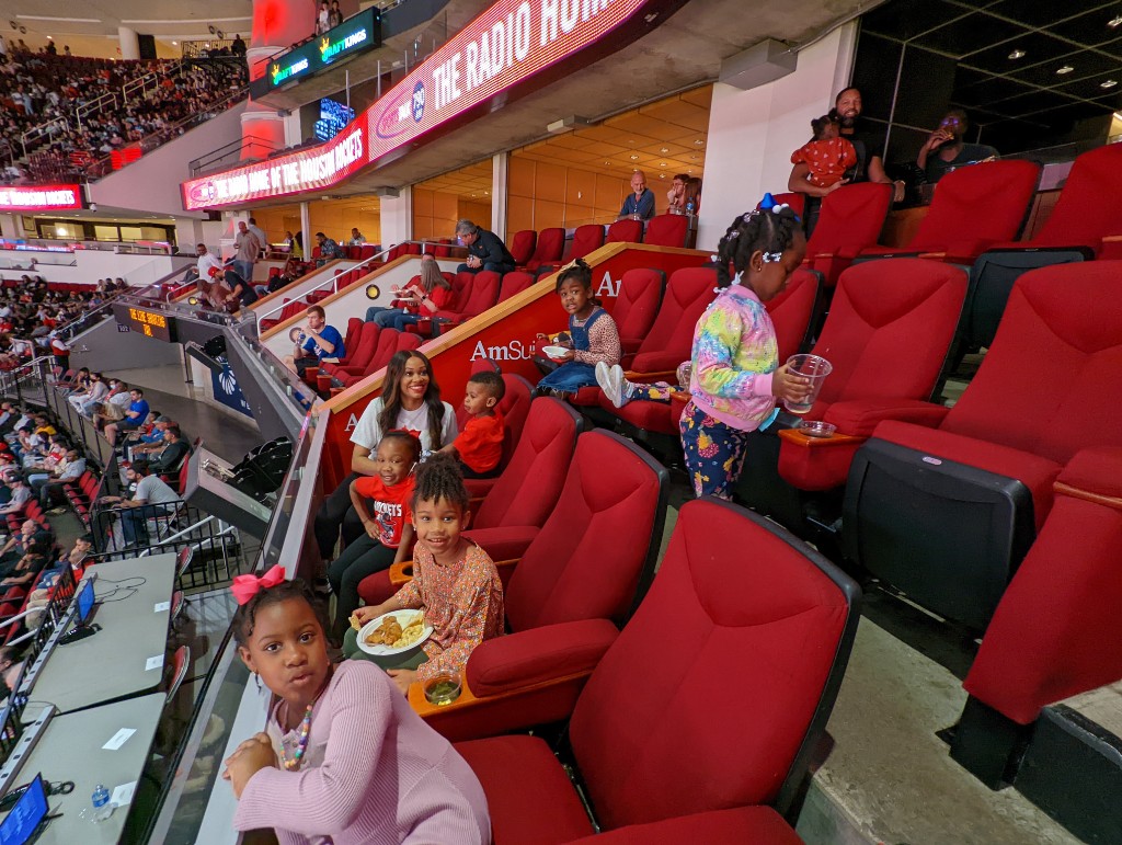Friends together at a basketball game, December 2021