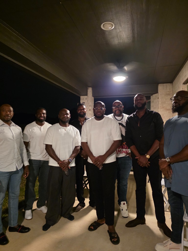 Two men posing in the entryway